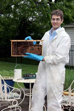 Mark Vanderwerp holds the rescued bee hive